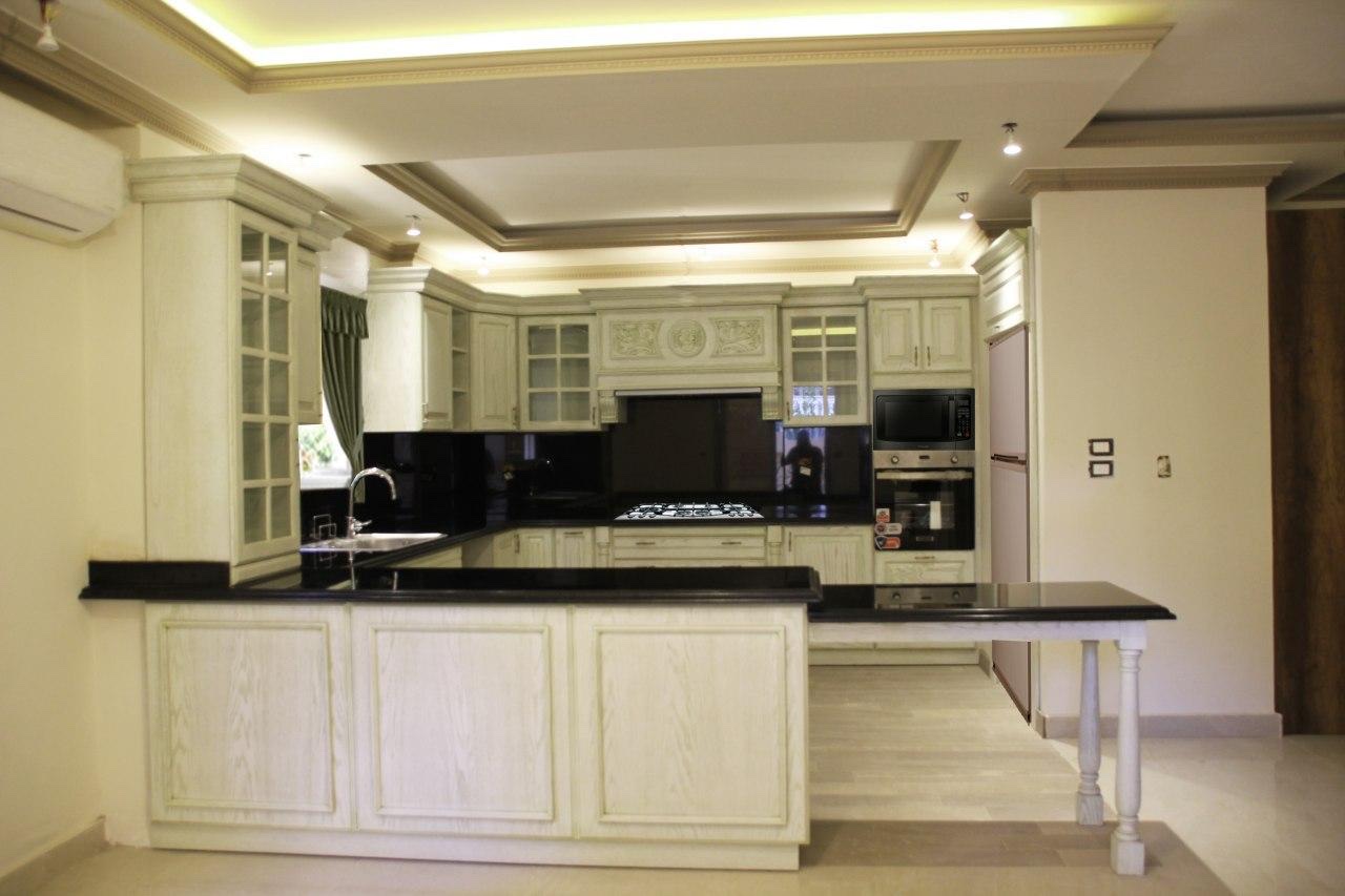 Classic white kitchen with black granite